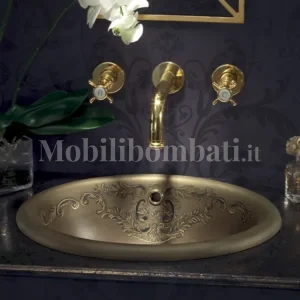 lavabo con superficie marrone satinata e decori in oro.
